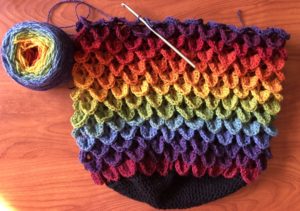 Crochet work of a bag with a dragon scale design